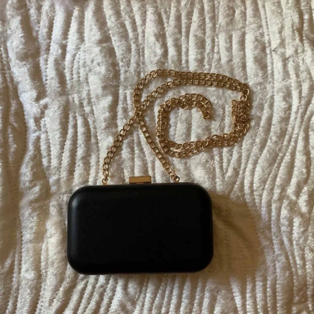 Black clutch with gold detailing